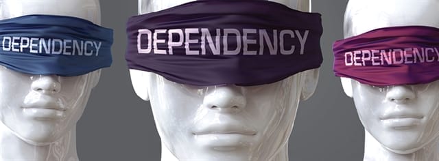 Mannequins with eye coverings that read "Dependency"