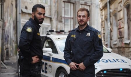 Law enforcement officers near squad car
