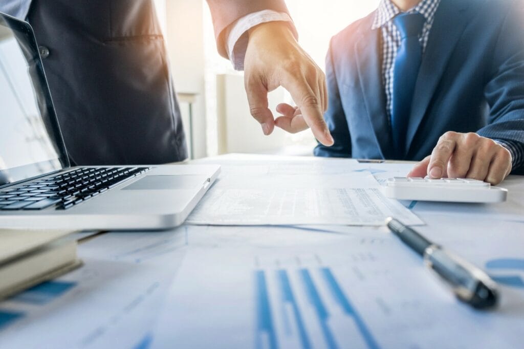 Auditor examining financial document