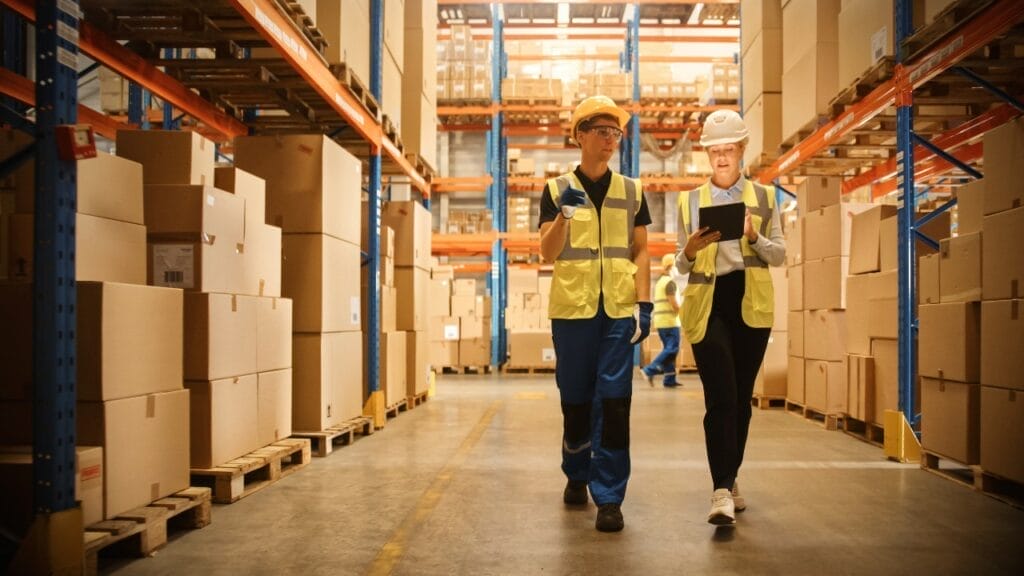 People working together in warehouse