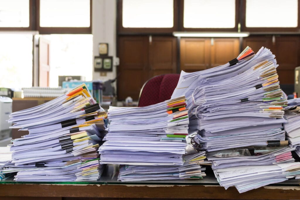 Stacks of paper on government worker's desk