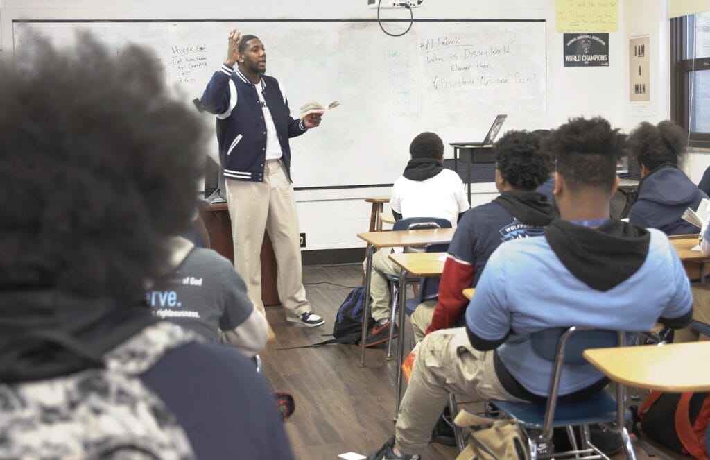 Teacher teaching students in classroom