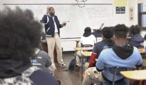 Teacher teaching students in classroom