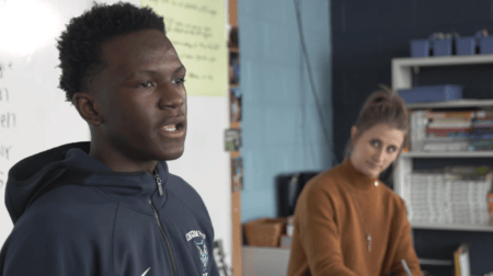 Wisconsin high school student giving speech in front of classroom