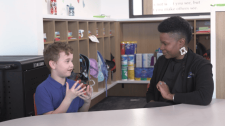 Student and teacher conversing at Beloit charter school, The Lincoln Academy.