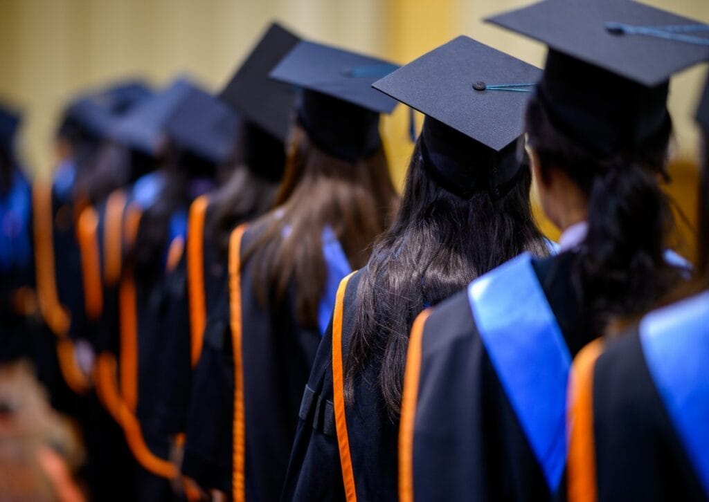 Students at a college graduation ceremony