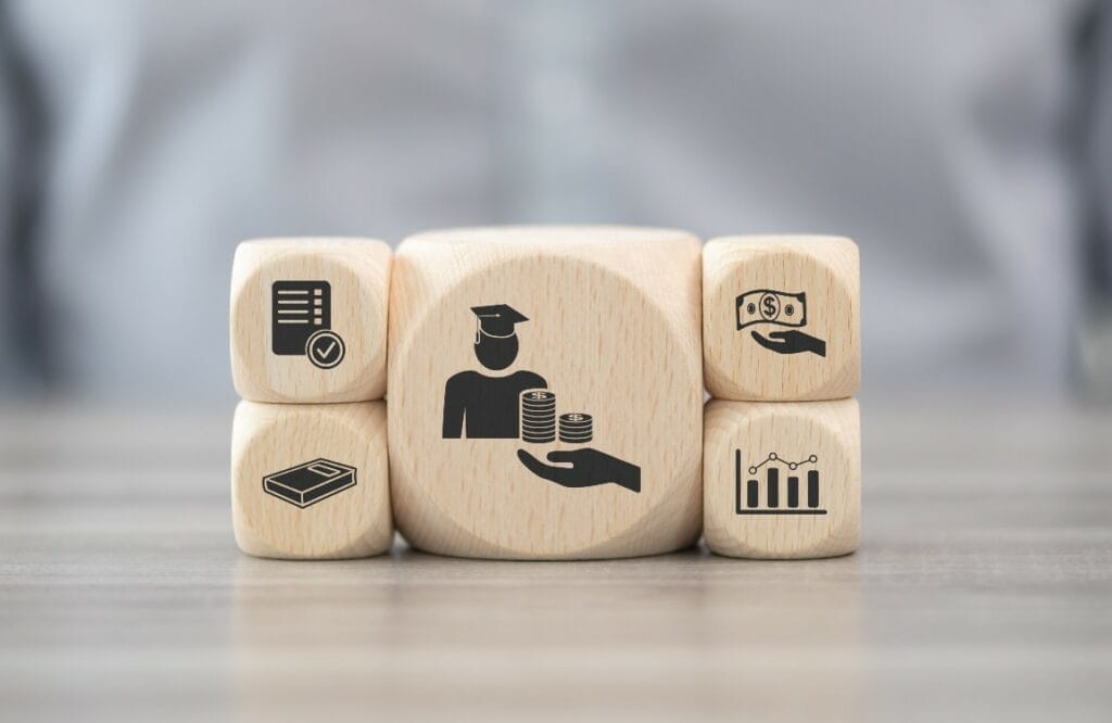 Wooden blocks depicting factors Wisconsin students must consider when taking on college loan debt