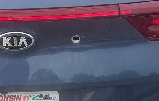 Bullet hole from Milwaukee Kia Boyz in trunk of car