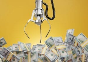 Claw game reaching into pool of dollars representing Wisconsin’s budget surplus