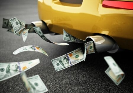 $100 bills being expelled from the exhaust pipe of a Wisconsin automobile
