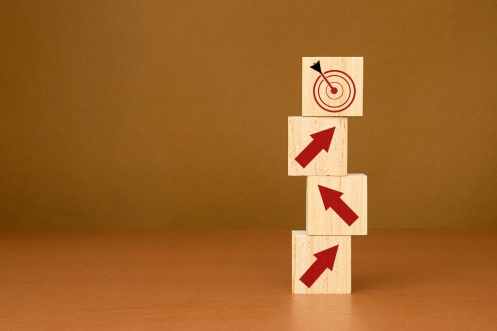 Image up blocks with upward arrows leading to a block with a target.