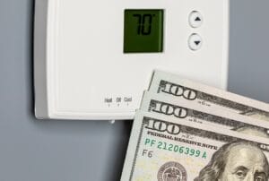 Wisconsin thermostat shown next to three $100 bills