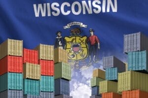 Image of Wisconsin state flag overlaid with large shipping crates