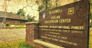Image of a sign outside the Blackwell Civilian Conservation Center overlaid with computer-generated cracks and distress.